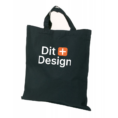 Sort stofpose med teksten "Dit Design" og et orange plus-tegn i midten. Posen har to håndtag og befinder sig mod en hvid baggrund.