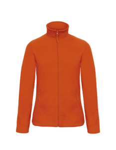 Orange jakke hænger i luften mod en hvid baggrund. Jakken har en lynlås foran og to lommer med lynlåse.