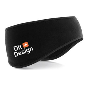 Sort pandebånd med teksten "Dit Design" trykt på siden. Pandebåndet ligger mod en hvid baggrund og er let buet.