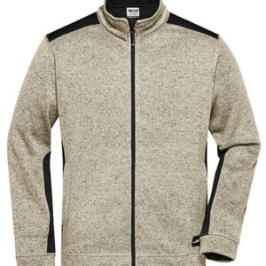 Trøje med lynlås og højt krave, lysegrå med sorte paneler på skuldre og langs ærmesiderne. Enkelt design, velegnet til køligt vejr. Ingen tekst til stede.