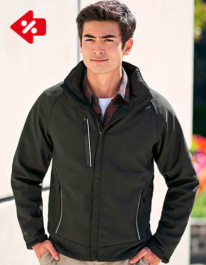 RG670 En person iført en mørk jakke står udenfor i sollys, med grønne planter i baggrunden. Der er ingen tekst i billedet.